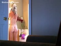 Hidden camera recording nude chick after shower